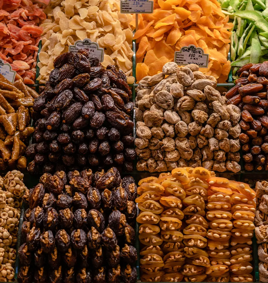 Wholesale market bins holding dozens of varieties of dried fruit and nuts