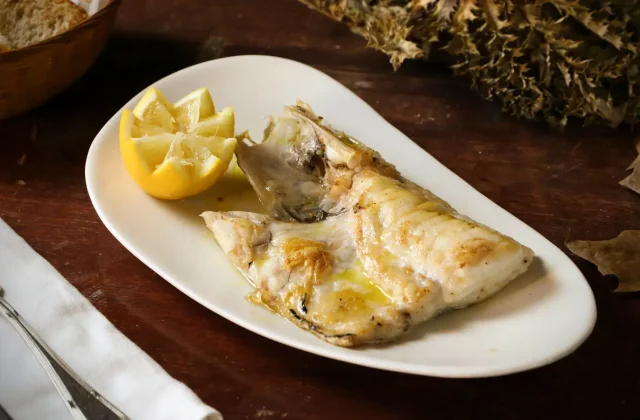Roasted artichoke hearts in oil on a plate