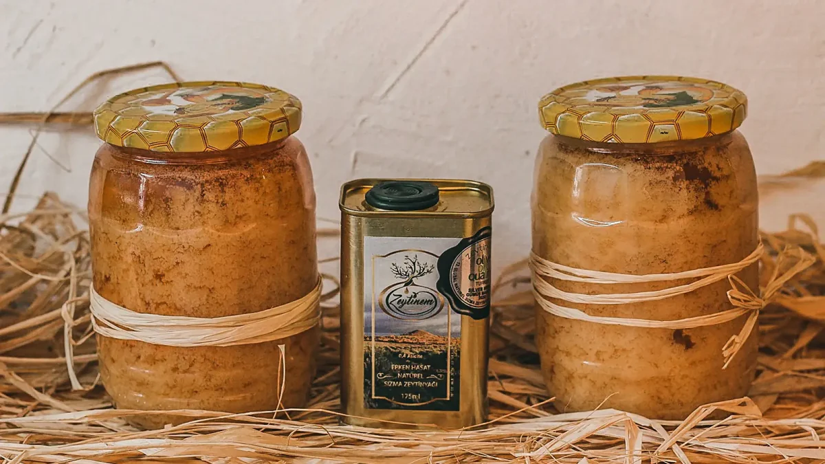 Rustic jars of thick carob molasses
