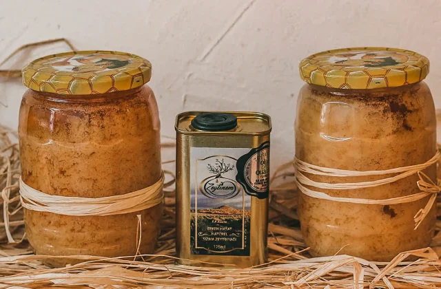 Rustic jars of thick carob molasses