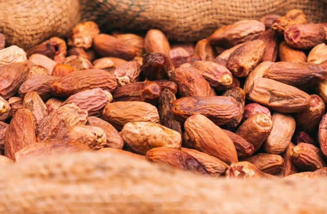 Loose dried dates in a hessian sack