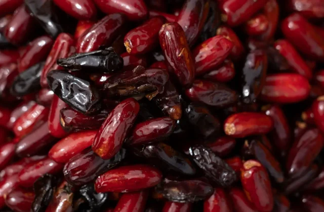 A pile of cleaned date seeds