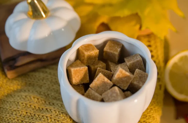 Brown sugar cubes in a white bowl