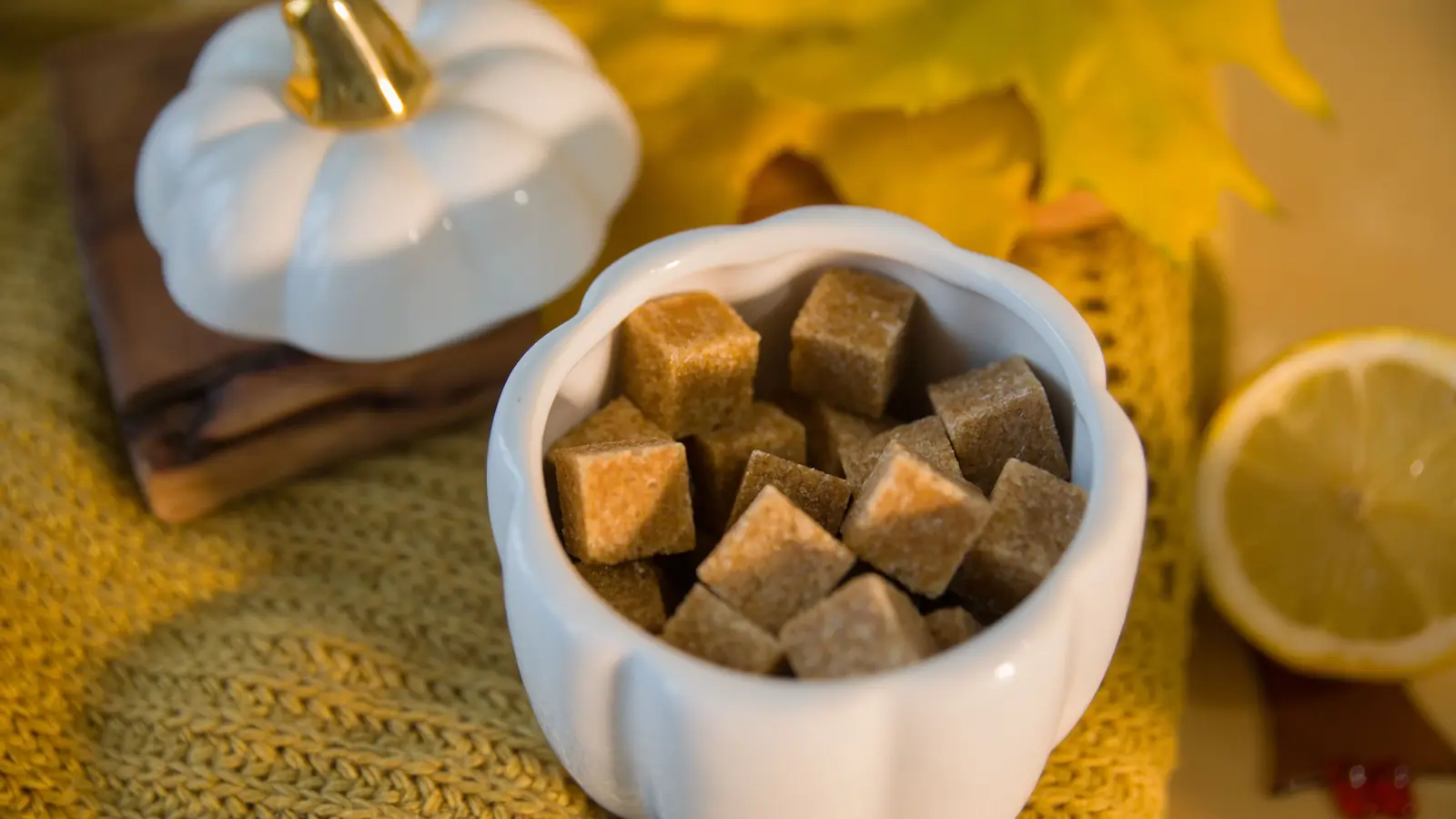 Brown sugar cubes in a white bowl
