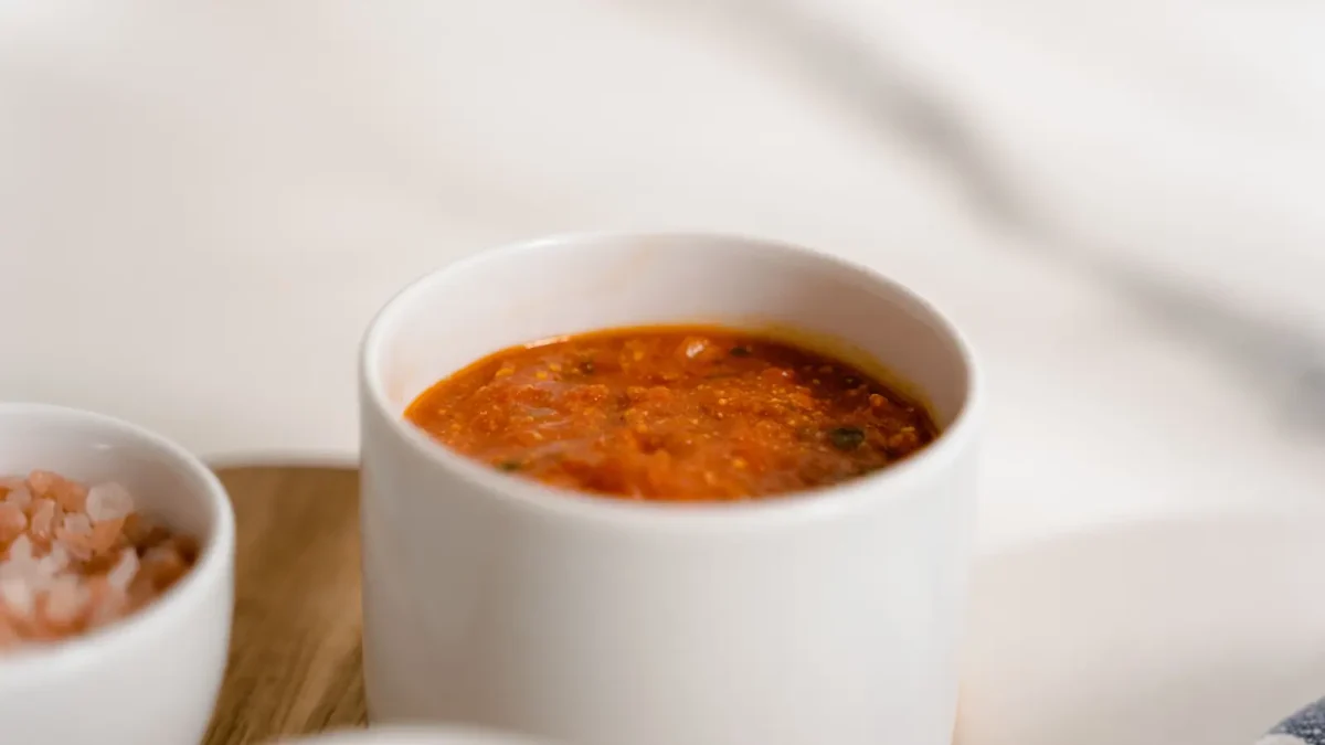 Harissa paste in a small cup