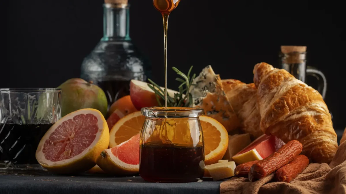 Dark date syrup poured over fruit and pastries