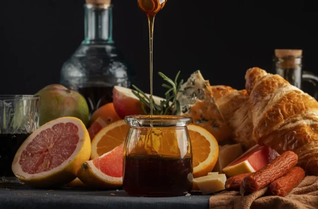 Dark date syrup poured over fruit and pastries