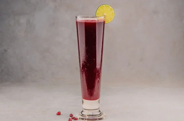 A tall glass of pomegranate juice